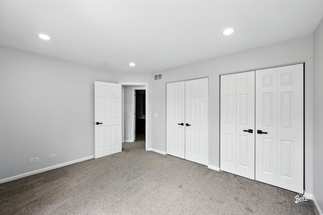 240 Taylor Ct, Buffalo Grove, IL 60089 - unfurnished bedroom with two closets, carpet floors, and recessed lighting