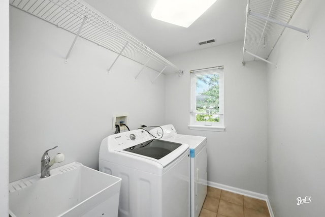 240 Taylor Ct, Buffalo Grove, IL 60089 - laundry room with washing machine and dryer and light tile patterned flooring