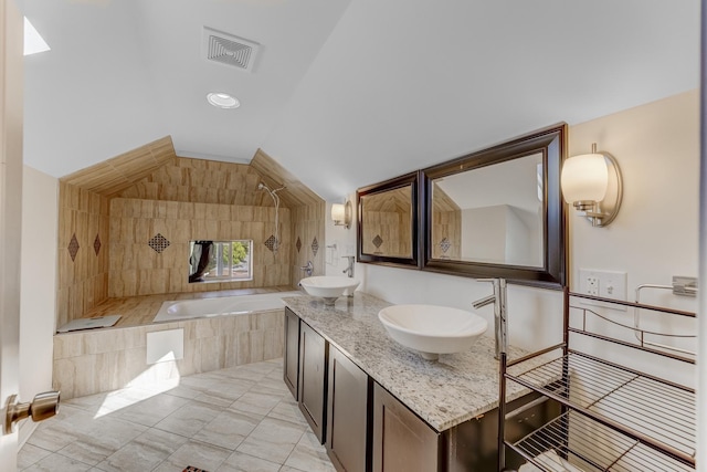 8212 S Justine St, Chicago, IL 60620 - full bathroom with a relaxing tiled tub, vaulted ceiling, double vanity, a tile shower, and tile patterned floors