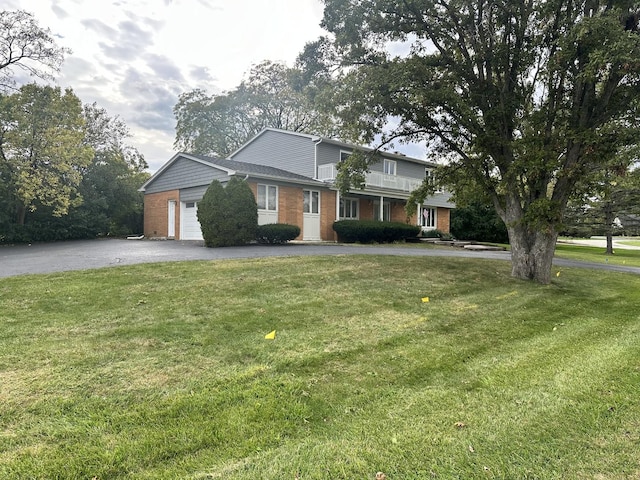 56 Graymoor Ln, Olympia Fields, IL 60461 - view of front of home with brick siding, driveway, and a front lawn