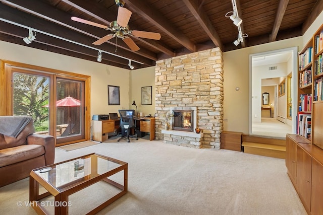 130 Old Dundee Rd, Barrington Hills, IL 60010 - carpeted living area featuring a wooden ceiling with exposed beams, an office area, track lighting, a fireplace, and a ceiling fan