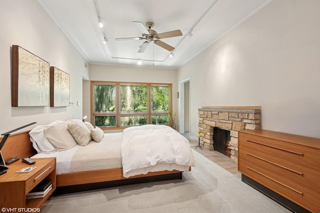 130 Old Dundee Rd, Barrington Hills, IL 60010 - carpeted bedroom with track lighting, a fireplace, ceiling fan, and ornamental molding