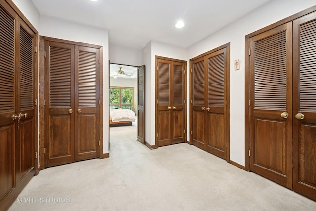 130 Old Dundee Rd, Barrington Hills, IL 60010 - unfurnished bedroom featuring light carpet, multiple closets, and recessed lighting