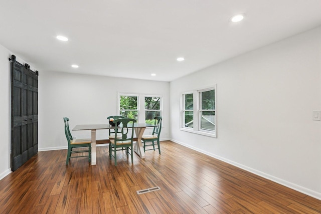 26931 W Marion Ct, Ingleside, IL 60041 - dining space with a barn door, recessed lighting, and wood finished floors