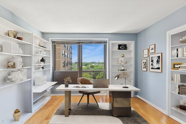 5050 S E End Ave Unit 9C, Chicago, IL 60615 - office area featuring light wood-style flooring and baseboards