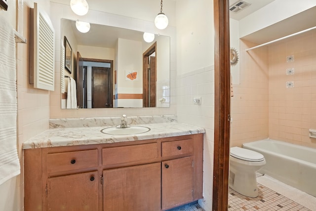 18205 Hart Dr Unit 2B, Homewood, IL 60430 - bathroom featuring tile walls, vanity, tub / shower combination, and tile patterned flooring