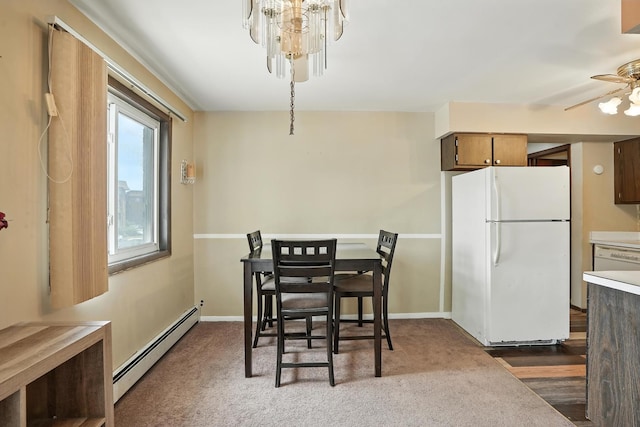 18205 Hart Dr Unit 2B, Homewood, IL 60430 - dining room with a baseboard radiator, a ceiling fan, and a chandelier