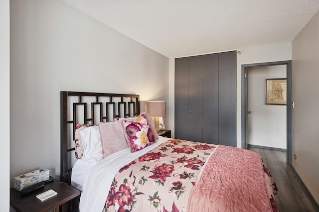 10 E Ontario St Unit 1304, Chicago, IL 60611 - bedroom with wood finished floors, a closet, and a textured ceiling