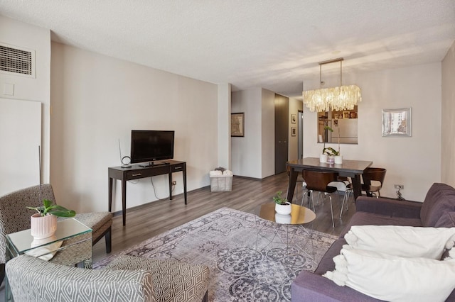 10 E Ontario St Unit 1304, Chicago, IL 60611 - living room with a chandelier, wood finished floors, and a textured ceiling