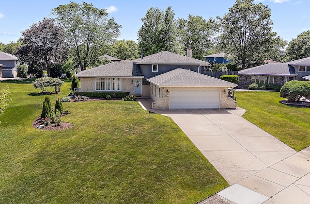 8941 Timothy Ct, Orland Park, IL 60462 - split level home featuring a garage, brick siding, driveway, and a front lawn