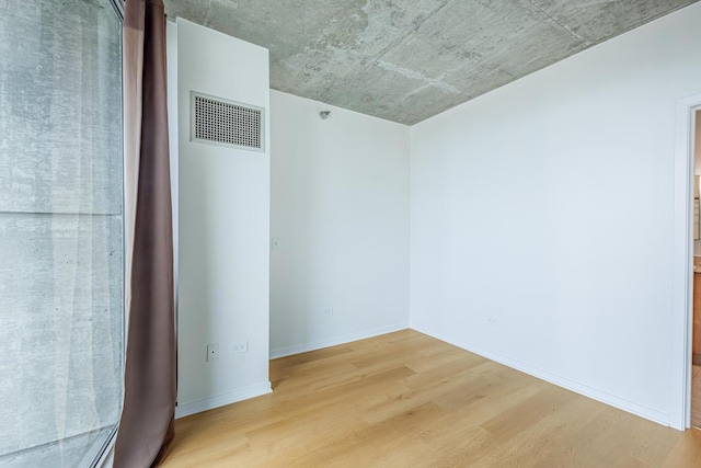 611 S Wells St Unit 2301, Chicago, IL 60607 - spare room featuring light wood-style floors and baseboards