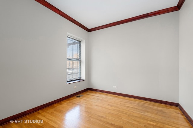 212 E 44th St Unit 2, Chicago, IL 60653 - unfurnished room with crown molding and light wood finished floors