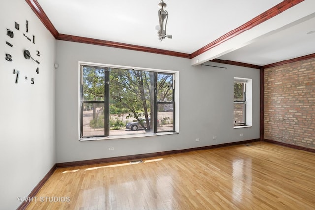 212 E 44th St Unit 2, Chicago, IL 60653 - unfurnished room featuring brick wall, wood finished floors, and crown molding
