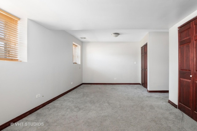 212 E 44th St Unit 2, Chicago, IL 60653 - unfurnished room with light carpet and baseboards