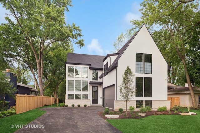 759 Strawberry Hill Dr, Glencoe, IL 60022 - view of front of property with driveway, stucco siding, stone siding, roof with shingles, and a garage