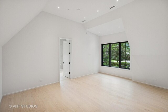 759 Strawberry Hill Dr, Glencoe, IL 60022 - spare room with light wood-style flooring, recessed lighting, and high vaulted ceiling