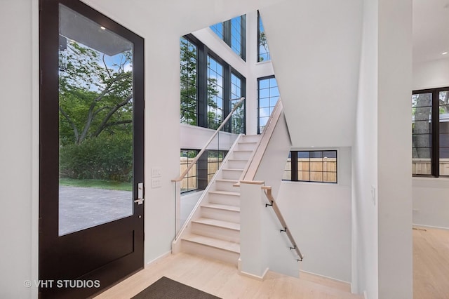 759 Strawberry Hill Dr, Glencoe, IL 60022 - entrance foyer featuring a high ceiling, wood finished floors, and stairway