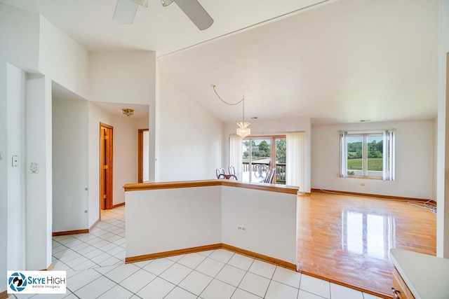 10825 Kathleen Ct Unit D, Palos Hills, IL 60465 - unfurnished room featuring ceiling fan, lofted ceiling, and light tile patterned floors
