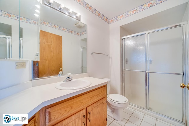 10825 Kathleen Ct Unit D, Palos Hills, IL 60465 - bathroom featuring vanity, a shower with door, and tile patterned floors