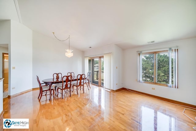 10825 Kathleen Ct Unit D, Palos Hills, IL 60465 - dining room featuring light wood-style flooring and vaulted ceiling