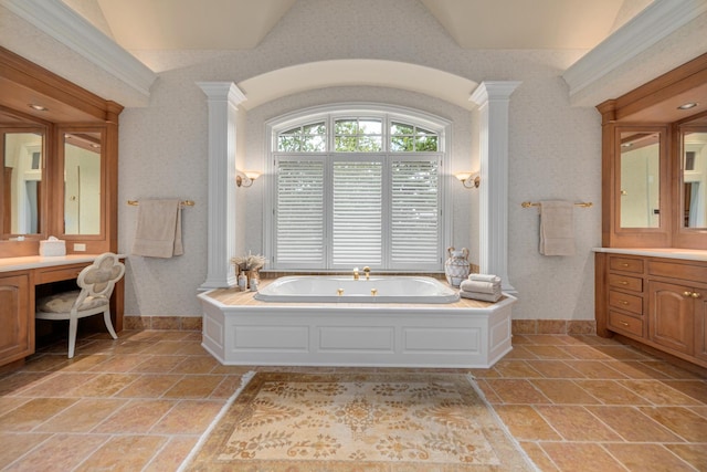 8698 S Madison St, Burr Ridge, IL 60527 - full bath featuring a bath, vanity, decorative columns, stone tile flooring, and lofted ceiling