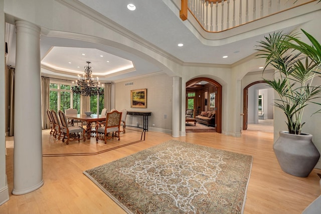 8698 S Madison St, Burr Ridge, IL 60527 - entrance foyer with arched walkways, a raised ceiling, a chandelier, plenty of natural light, and recessed lighting