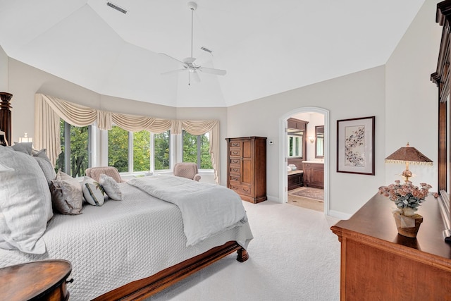 8698 S Madison St, Burr Ridge, IL 60527 - bedroom with light colored carpet, arched walkways, connected bathroom, a ceiling fan, and high vaulted ceiling