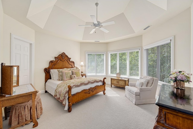 8698 S Madison St, Burr Ridge, IL 60527 - carpeted bedroom featuring a tray ceiling and ceiling fan