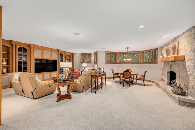 8698 S Madison St, Burr Ridge, IL 60527 - living room with light colored carpet, a stone fireplace, and recessed lighting