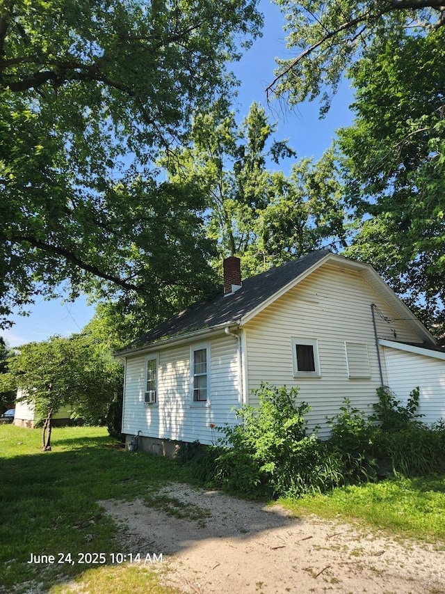 6 O Neil Ct, Champaign, IL 61820 - view of side of home featuring a chimney and a lawn