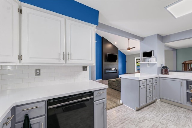 501 N Center St, Colfax, IL 61728 - kitchen with light wood-style floors, gray cabinets, ceiling fan, black dishwasher, and lofted ceiling