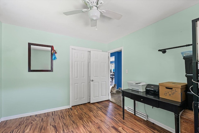 501 N Center St, Colfax, IL 61728 - office area with wood finished floors and ceiling fan