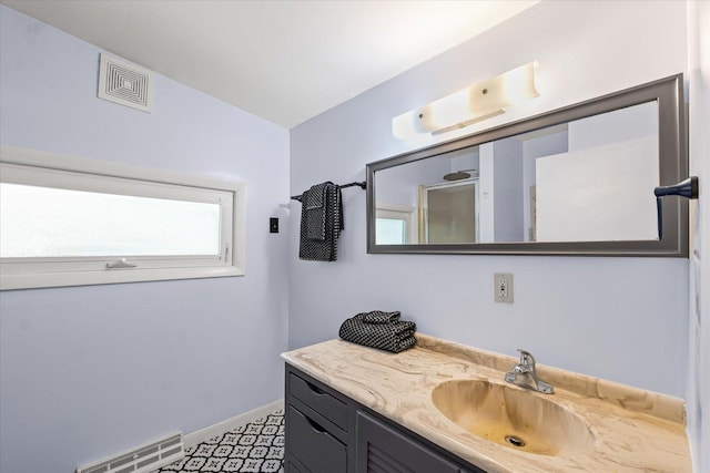 501 N Center St, Colfax, IL 61728 - bathroom featuring vanity and a shower