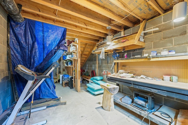 501 N Center St, Colfax, IL 61728 - unfinished basement featuring concrete block wall and a workshop area