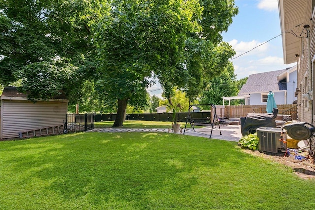501 N Center St, Colfax, IL 61728 - fenced backyard with a patio and an outdoor structure