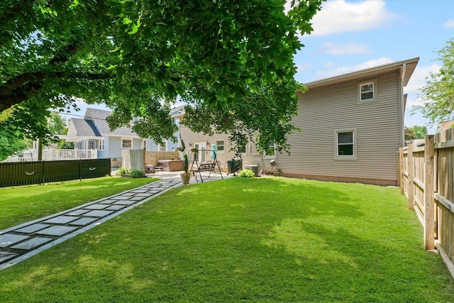501 N Center St, Colfax, IL 61728 - fenced backyard with a patio area