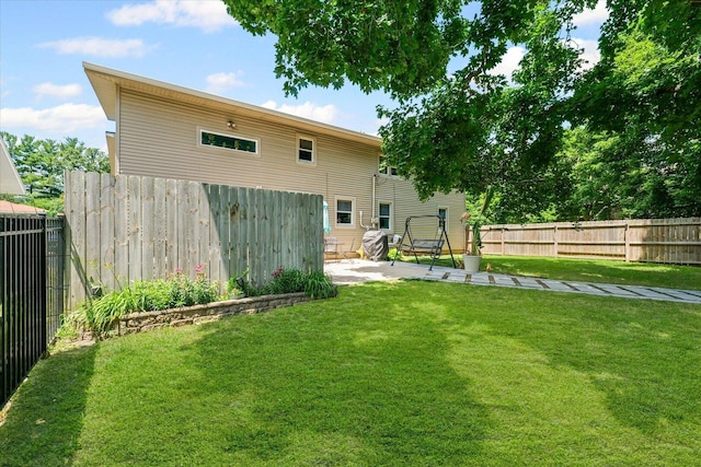 501 N Center St, Colfax, IL 61728 - back of house featuring a patio and a fenced backyard