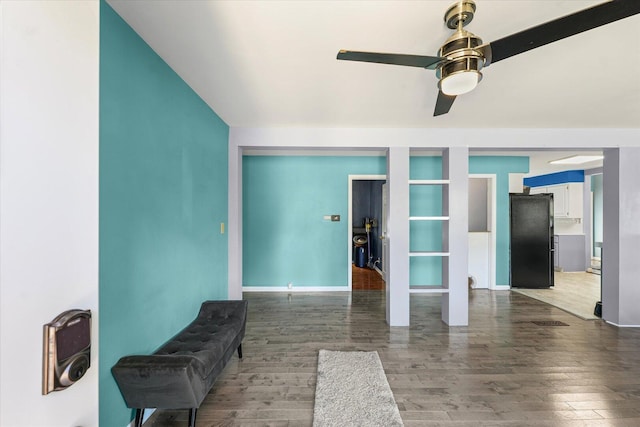 501 N Center St, Colfax, IL 61728 - living area with a ceiling fan, wood finished floors, vaulted ceiling, and built in shelves