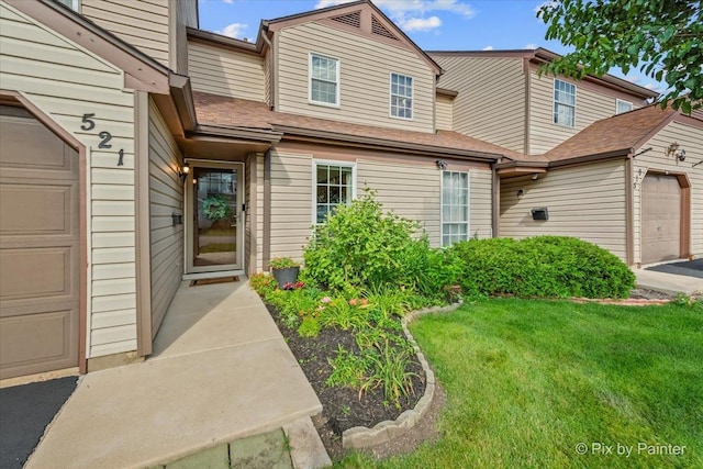 521 Nebraska Cir, Carol Stream, IL 60188 - view of front of property with a front lawn and an attached garage