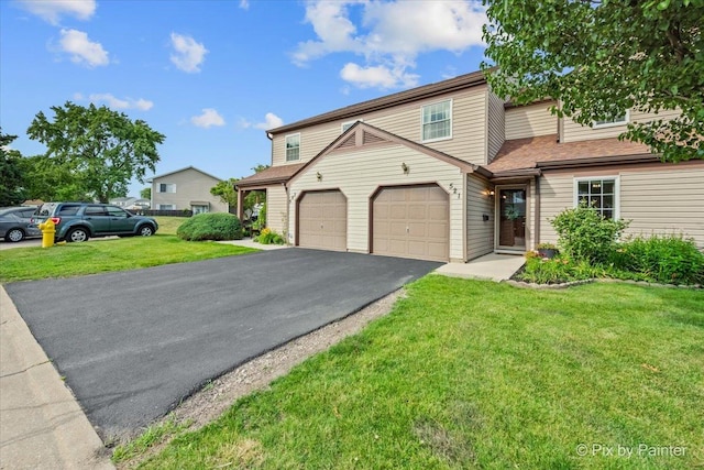 521 Nebraska Cir, Carol Stream, IL 60188 - multi unit property featuring driveway, a front lawn, and an attached garage