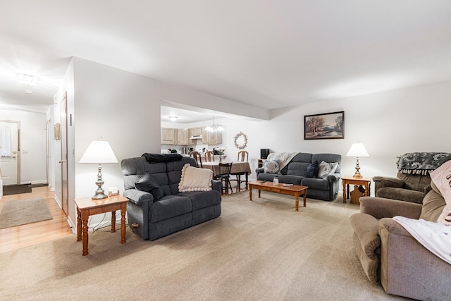 1937 Bayview Ln Unit 0, Aurora, IL 60506 - living room featuring light carpet and a chandelier
