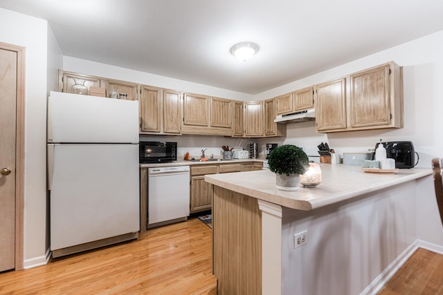 1937 Bayview Ln Unit 0, Aurora, IL 60506 - kitchen featuring white appliances, under cabinet range hood, light countertops, a peninsula, and light wood-style floors