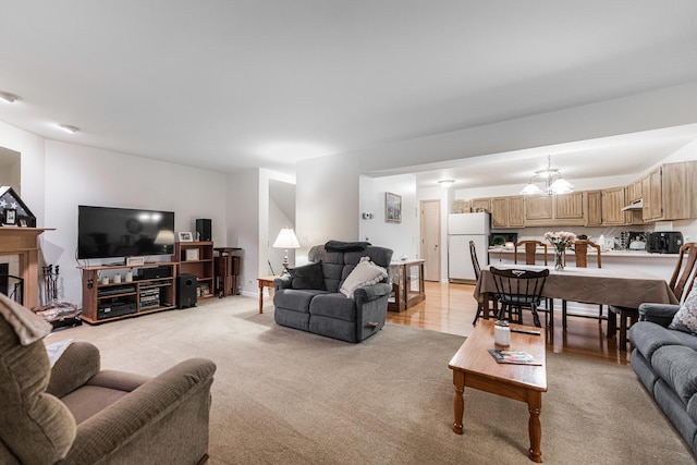 1937 Bayview Ln Unit 0, Aurora, IL 60506 - living area with a tile fireplace, a chandelier, and light colored carpet