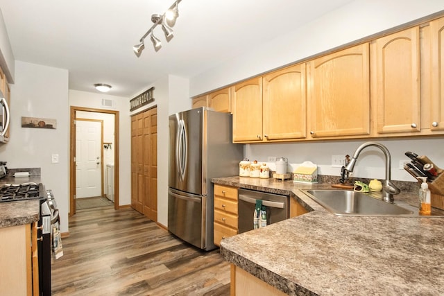 406 Kresswood Dr, Mchenry, IL 60050 - kitchen with appliances with stainless steel finishes, light brown cabinetry, wood finished floors, and dark countertops