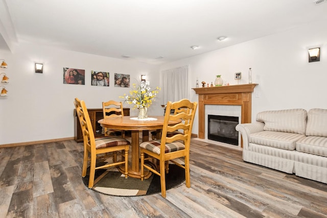 406 Kresswood Dr, Mchenry, IL 60050 - dining room with wood finished floors and a fireplace with flush hearth