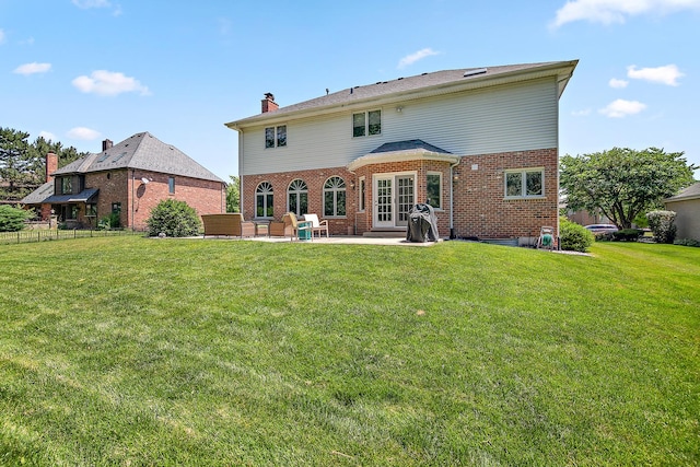 12532 Suffield Dr, Palos Park, IL 60464 - back of house featuring brick siding, a patio, a chimney, and french doors