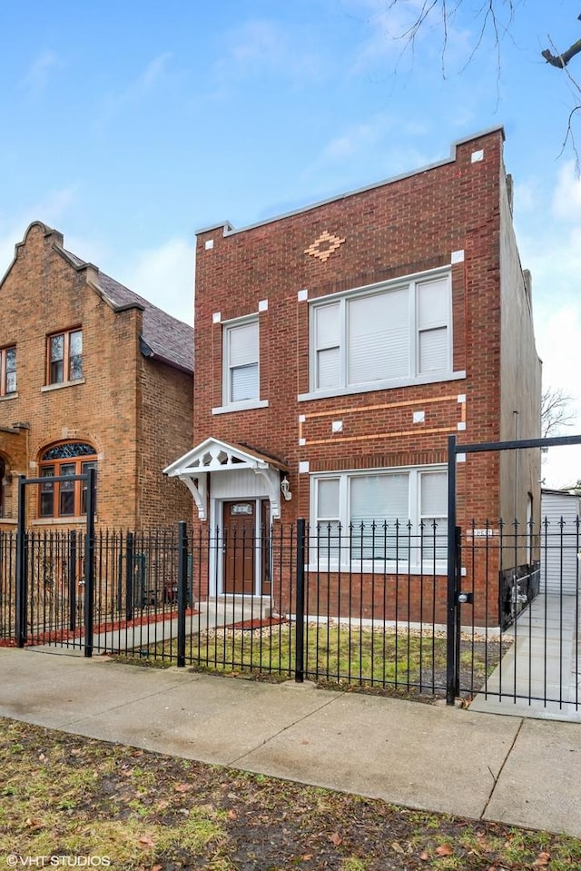 2345 S Lawndale Ave, Chicago, IL 60623 - view of front of property featuring brick siding and a fenced front yard