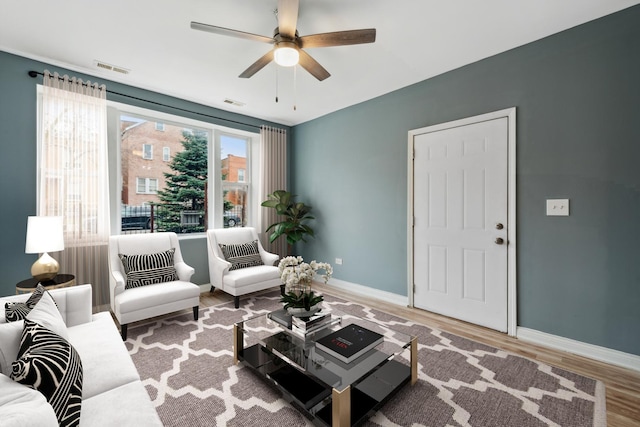2345 S Lawndale Ave, Chicago, IL 60623 - living area with wood finished floors and a ceiling fan