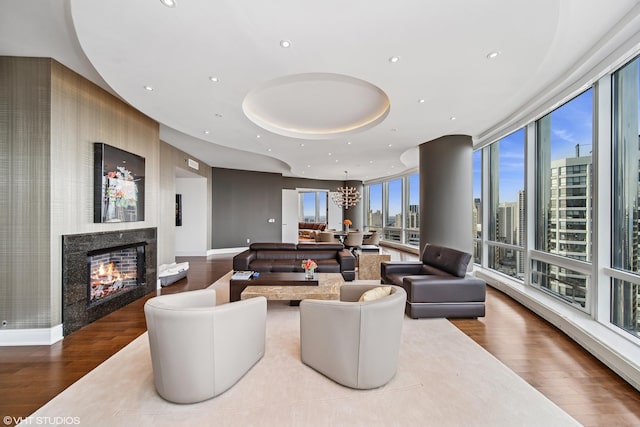 401 N Wabash St Unit 33A, Chicago, IL 60611 - living area with wood finished floors, a premium fireplace, a chandelier, recessed lighting, and a city view