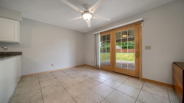1126 Ingram Rd, Rockford, IL 61108 - unfurnished dining area featuring light tile patterned floors and a ceiling fan